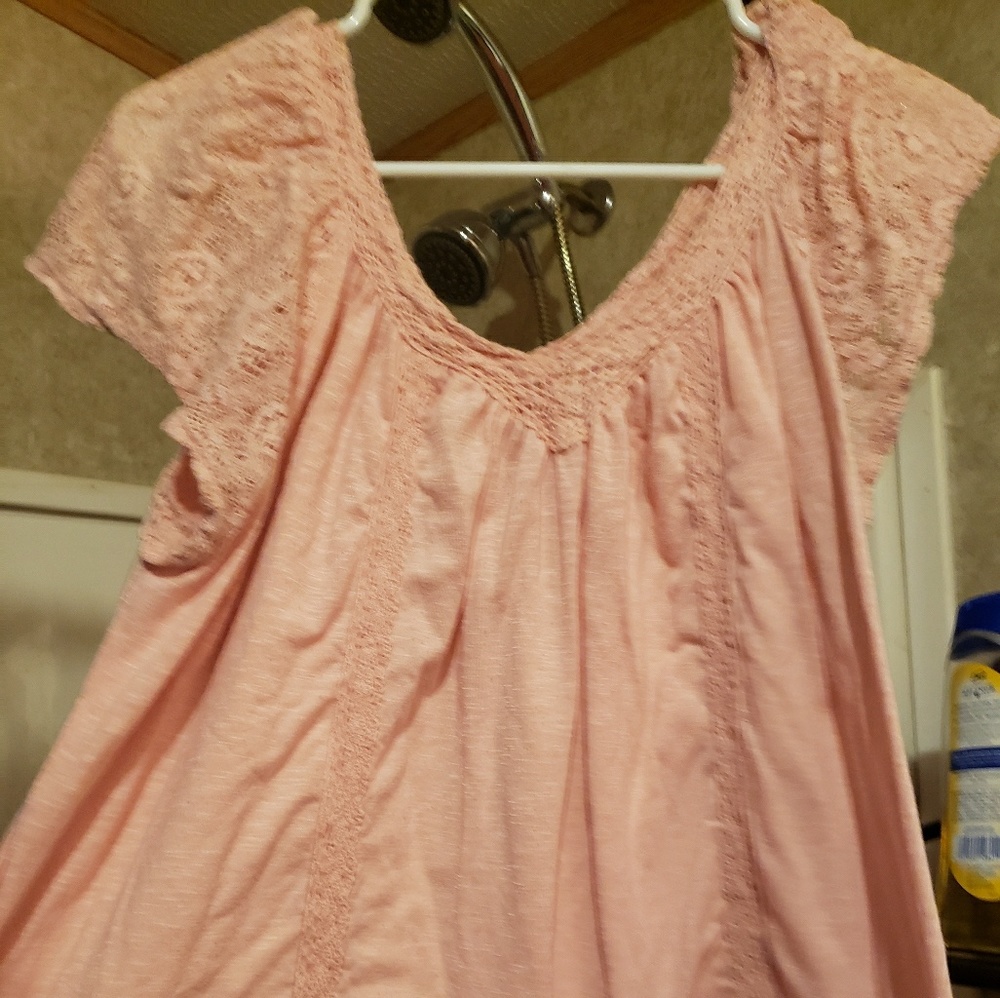 Light pink top with sewn in design